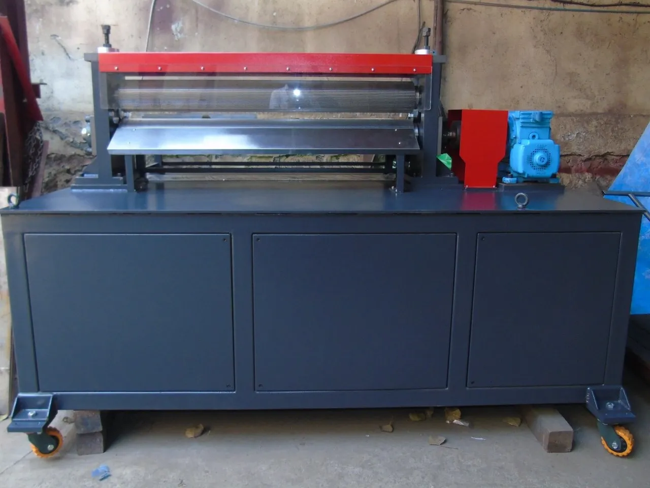 Corrugation machine built for BARC, with a full-width roller bed and geared drive